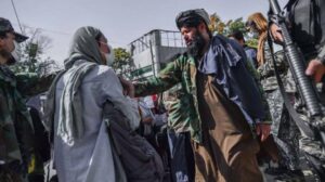 woman approaching Taliban in Afghanistan